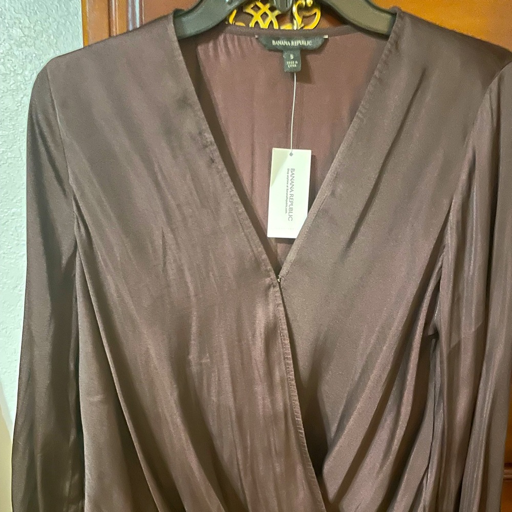 Silk deep purple blouse.  Never worn, elastic at the sleeves wrist area.